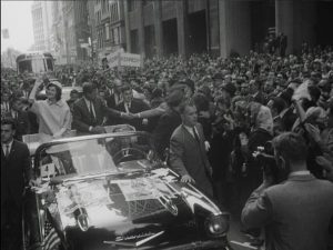 Senator and Mrs. Kennedy campaign during a ticker-tape parade in New York City in October 1960. NOTE: Frame grab from the Hearst Movietone newsreel "The Election of John F. Kennedy," USIA