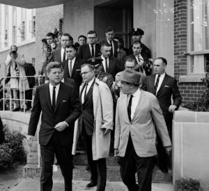 Press surround President Kennedy during a brief visit to Dallas on October 9, 1961.